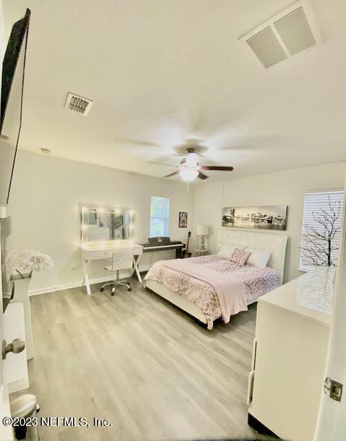 3949 Ringneck Drive Jacksonville, FL 32226 - Photo 13 of 16 a spacious bedroom with a bed and a cabinets