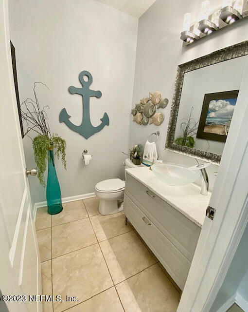 3949 Ringneck Drive Jacksonville, FL 32226 - Photo 8 of 16 a bathroom with a sink and a mirror