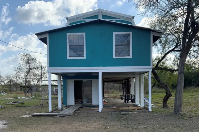 a house with trees in front of it