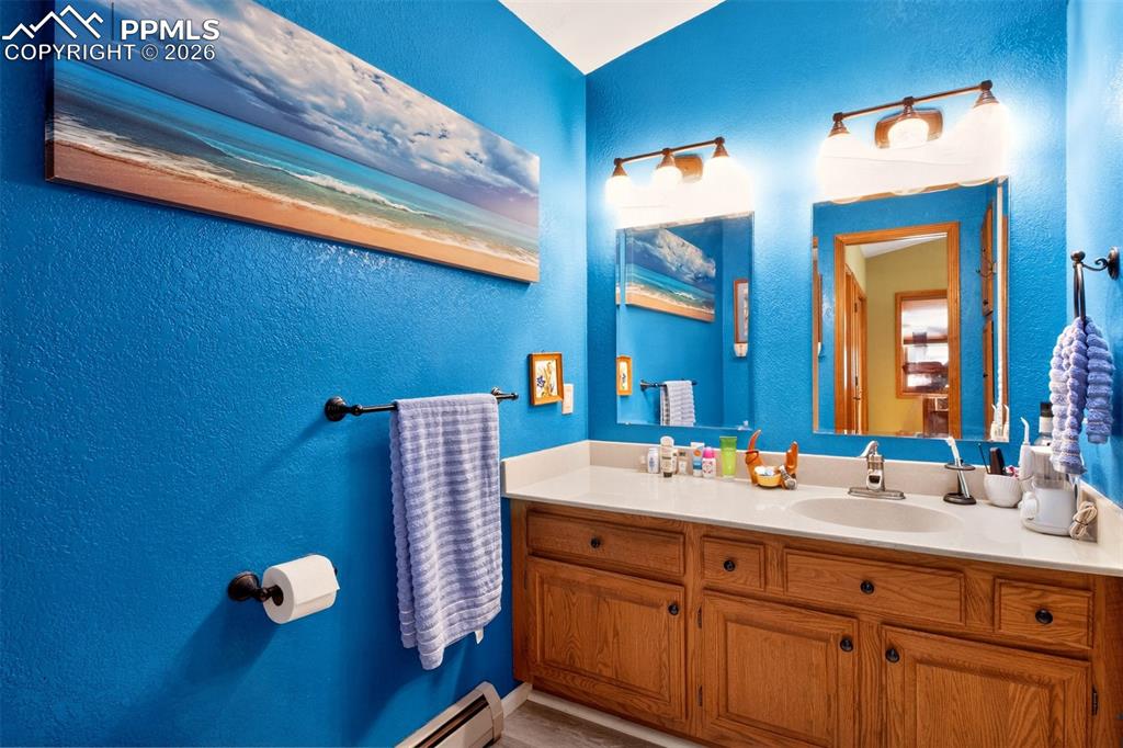 1445 Sutherland Creek Road Manitou Springs, CO 80829 - Photo 20 of 43 a bathroom with a sink and a mirror