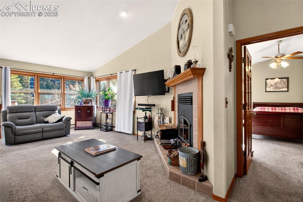 1445 Sutherland Creek Road Manitou Springs, CO 80829 - Photo 8 of 43 a living room with furniture and a large window