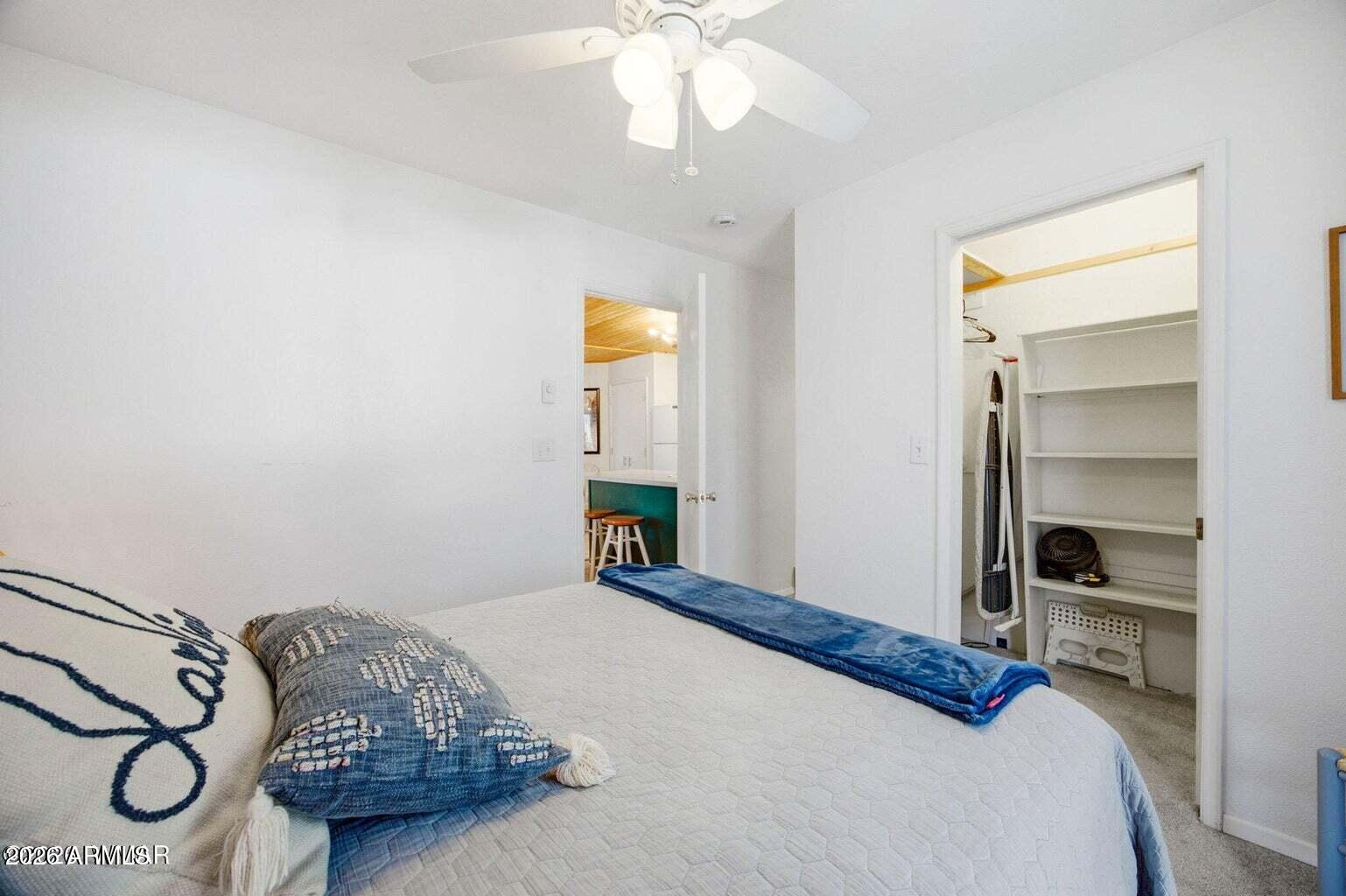 2700 South White Mountain Road, Unit 404 Show Low, AZ 85901 - Photo 13 of 20 a bedroom with a bed and a window