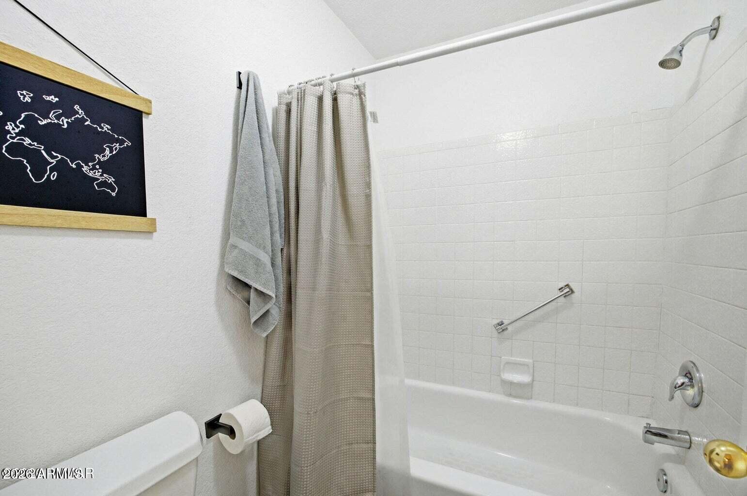 2700 South White Mountain Road, Unit 404 Show Low, AZ 85901 - Photo 15 of 20 a bathroom with a shower and a tub