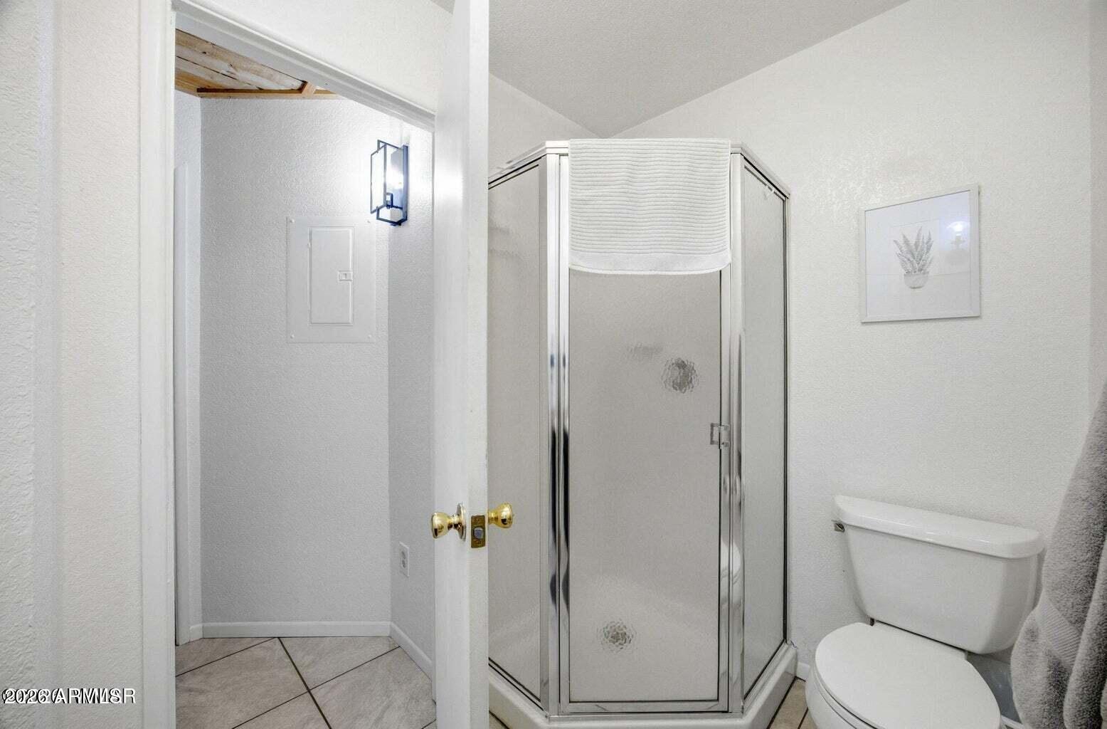 2700 South White Mountain Road, Unit 404 Show Low, AZ 85901 - Photo 18 of 20 a bathroom with a toilet and a shower
