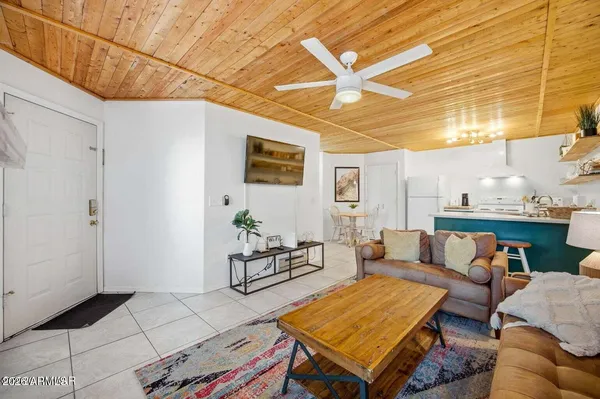 a living room with furniture and a table