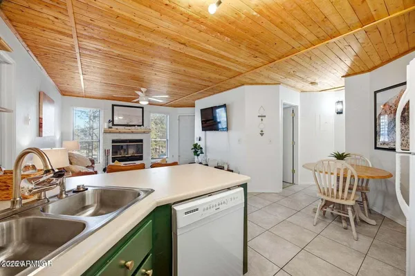 a kitchen with a sink cabinets and appliances