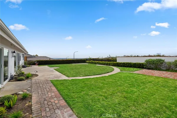a view of a swimming pool with a yard