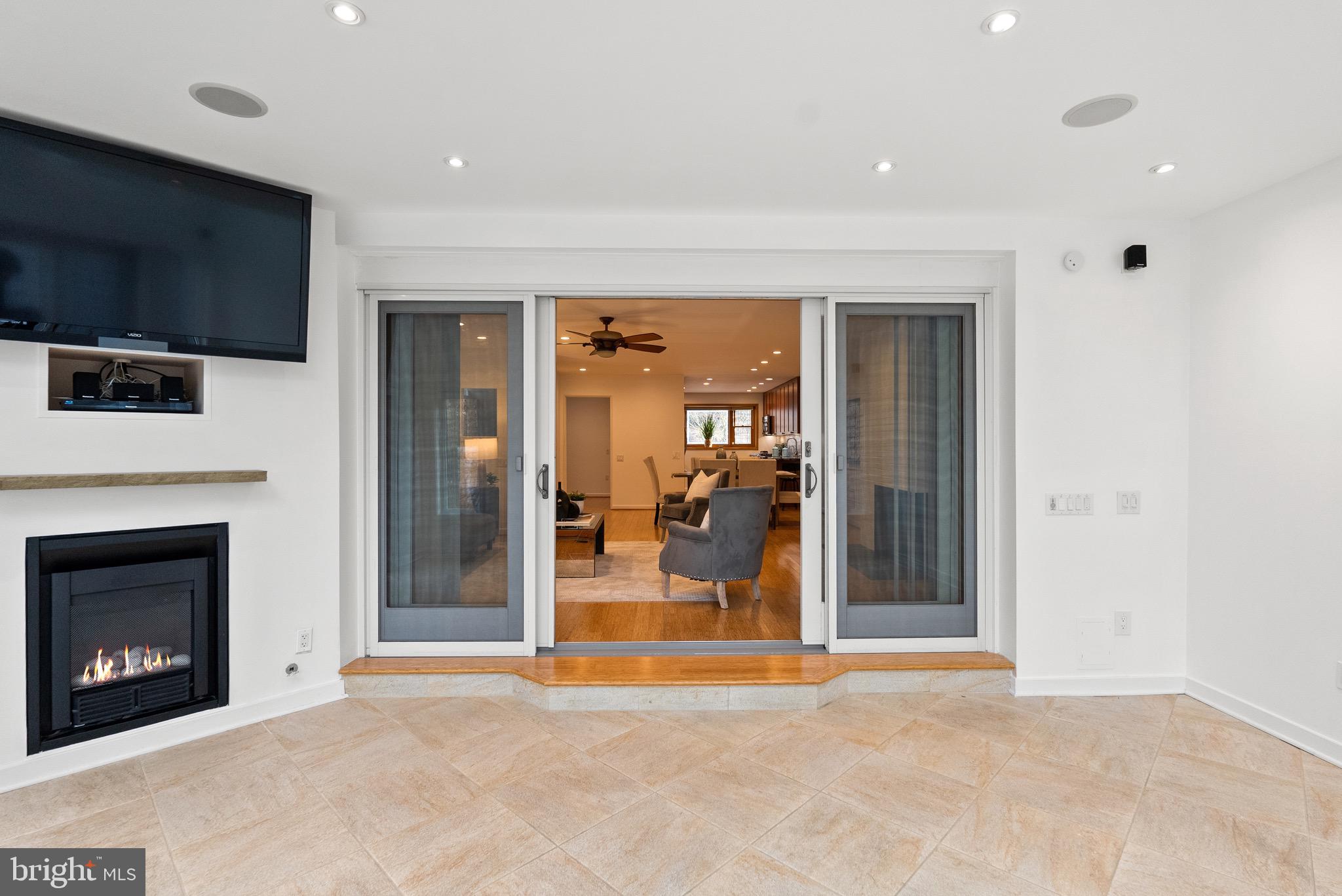 4854 Reservoir Road Northwest Washington, DC 20007 - Photo 19 of 53 Sunroom with fireplace