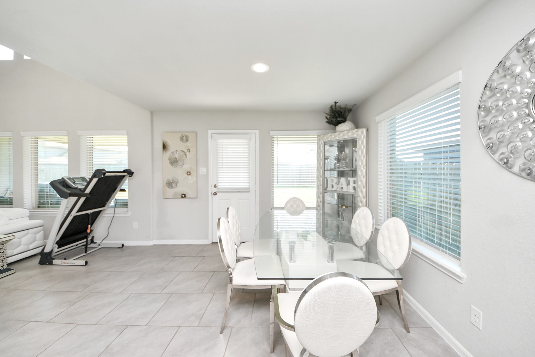 3514 Windham Way Katy, TX 77494 - Photo 23 of 42 a living room with furniture a large window and potted plants