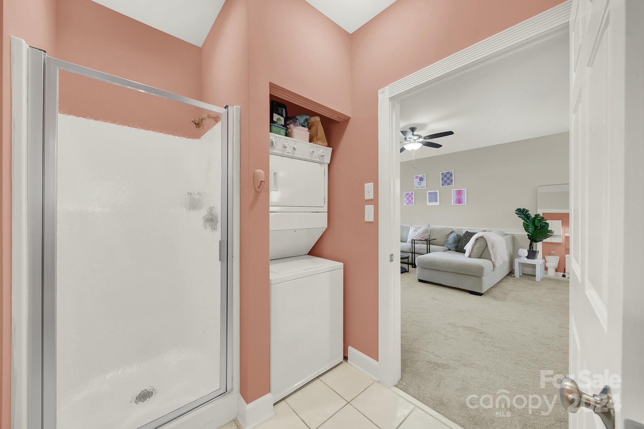 8959 Meadow Vista Road Charlotte, NC 28213 - Photo 11 of 32 a living room with furniture and a glass door shower