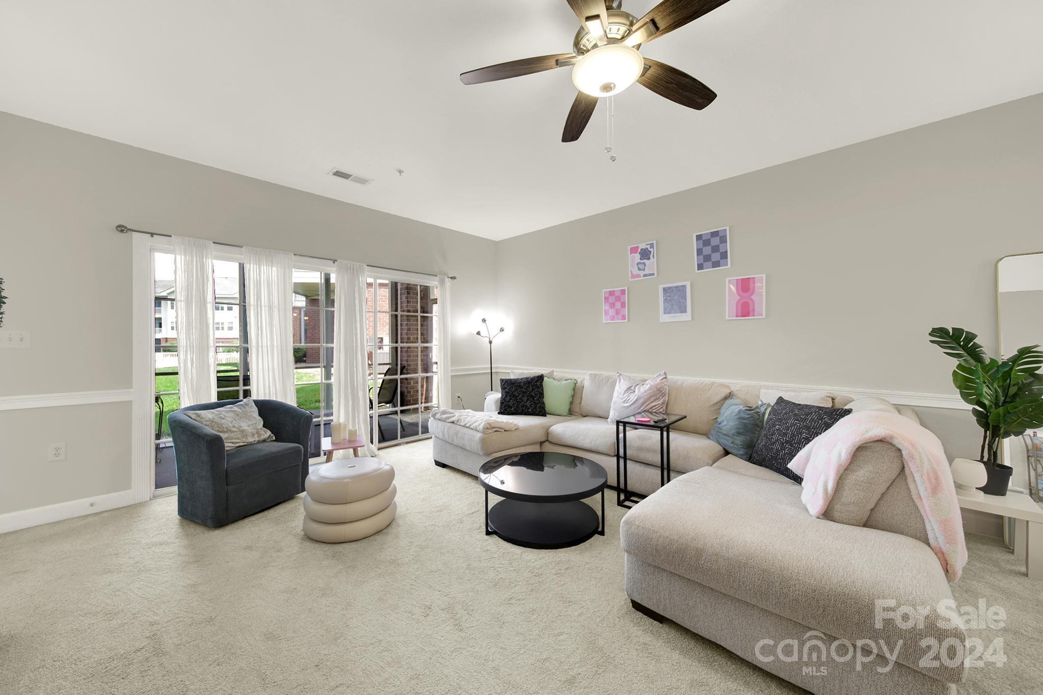 8959 Meadow Vista Road Charlotte, NC 28213 - Photo 13 of 32 a living room with furniture and a large window