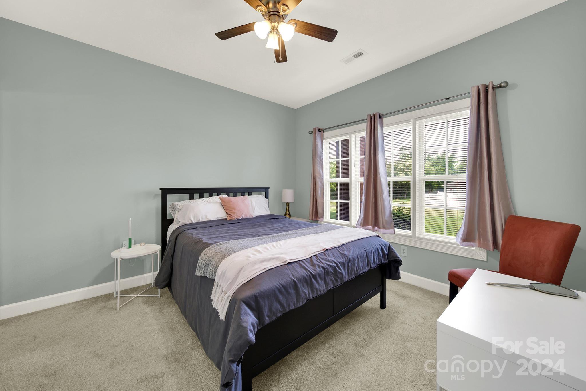8959 Meadow Vista Road Charlotte, NC 28213 - Photo 17 of 32 a bedroom with a bed and window
