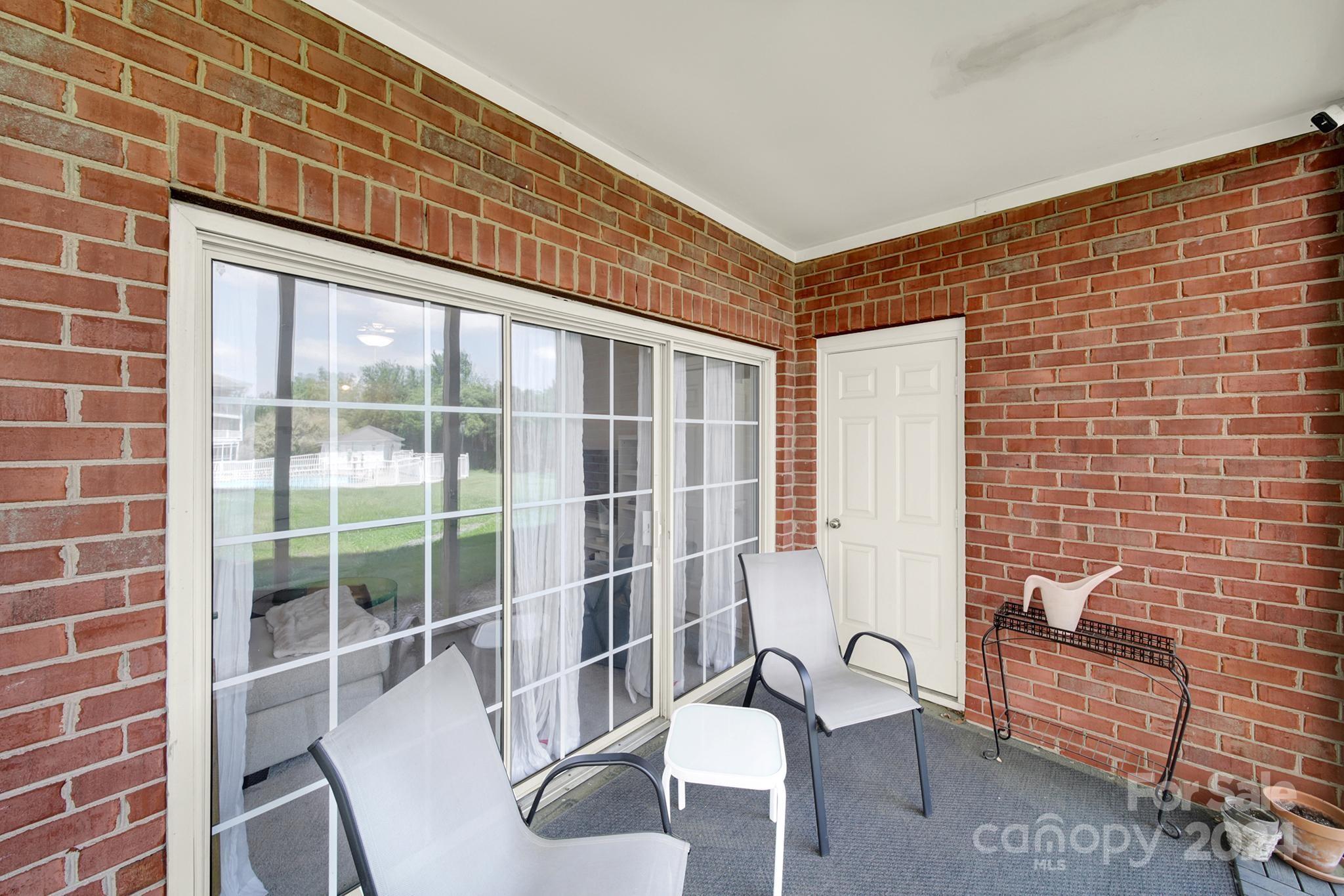 8959 Meadow Vista Road Charlotte, NC 28213 - Photo 24 of 32 a house view with a seating space