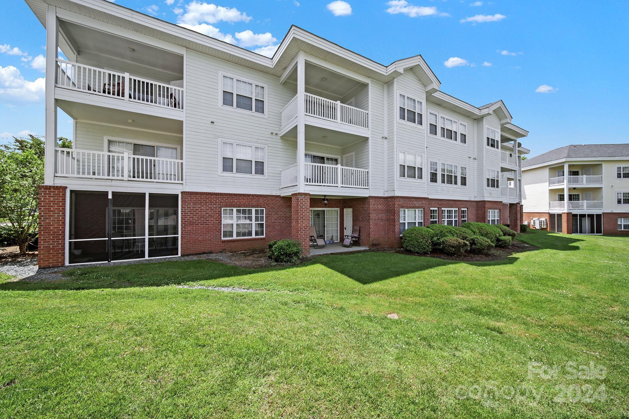 8959 Meadow Vista Road Charlotte, NC 28213 - Photo 27 of 32 a view of a building with a yard