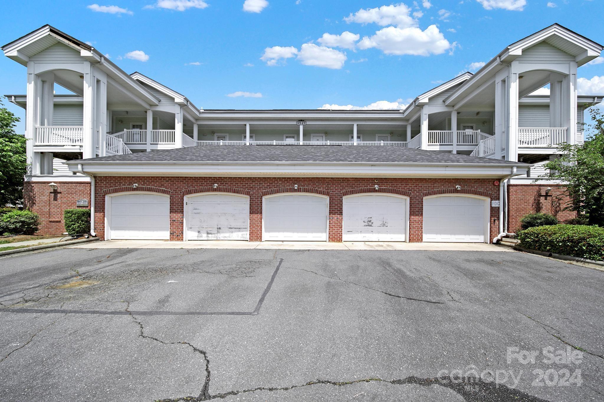8959 Meadow Vista Road Charlotte, NC 28213 - Photo 29 of 32 a front view of a house with a yard and garage