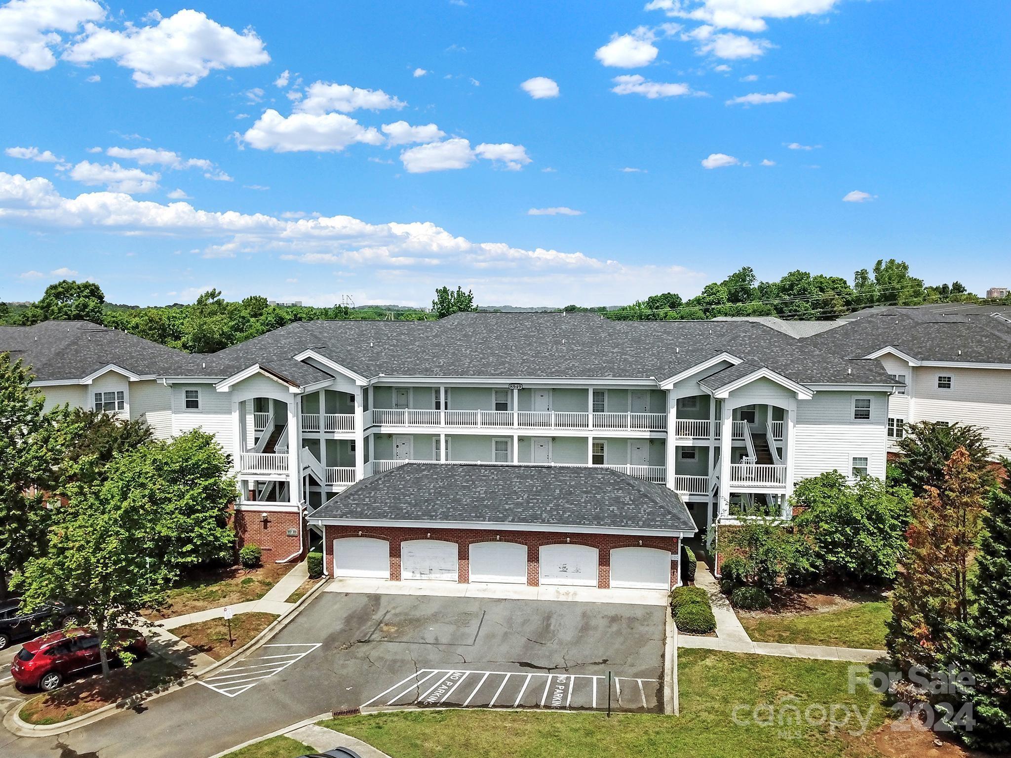 8959 Meadow Vista Road Charlotte, NC 28213 - Photo 30 of 32 a view of a big house with a big yard and potted plants