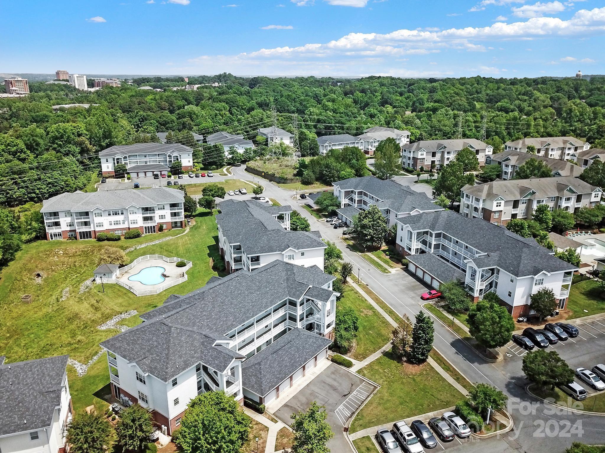 8959 Meadow Vista Road Charlotte, NC 28213 - Photo 32 of 32 an aerial view of a city with lots of residential buildings ocean and mountain view in back