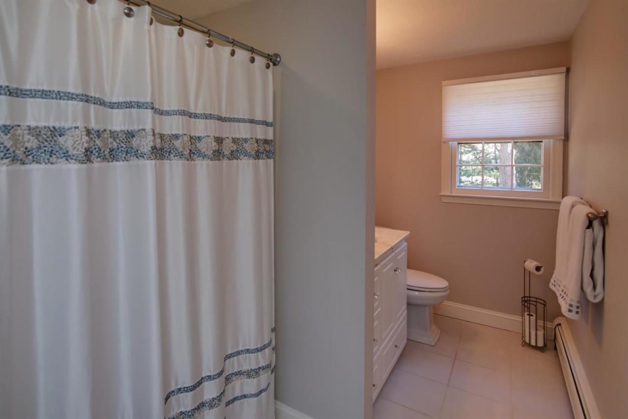 140 Ansel Howland Road Centerville, MA 02632 - Photo 15 of 26 a bathroom with a toilet a sink and a shower