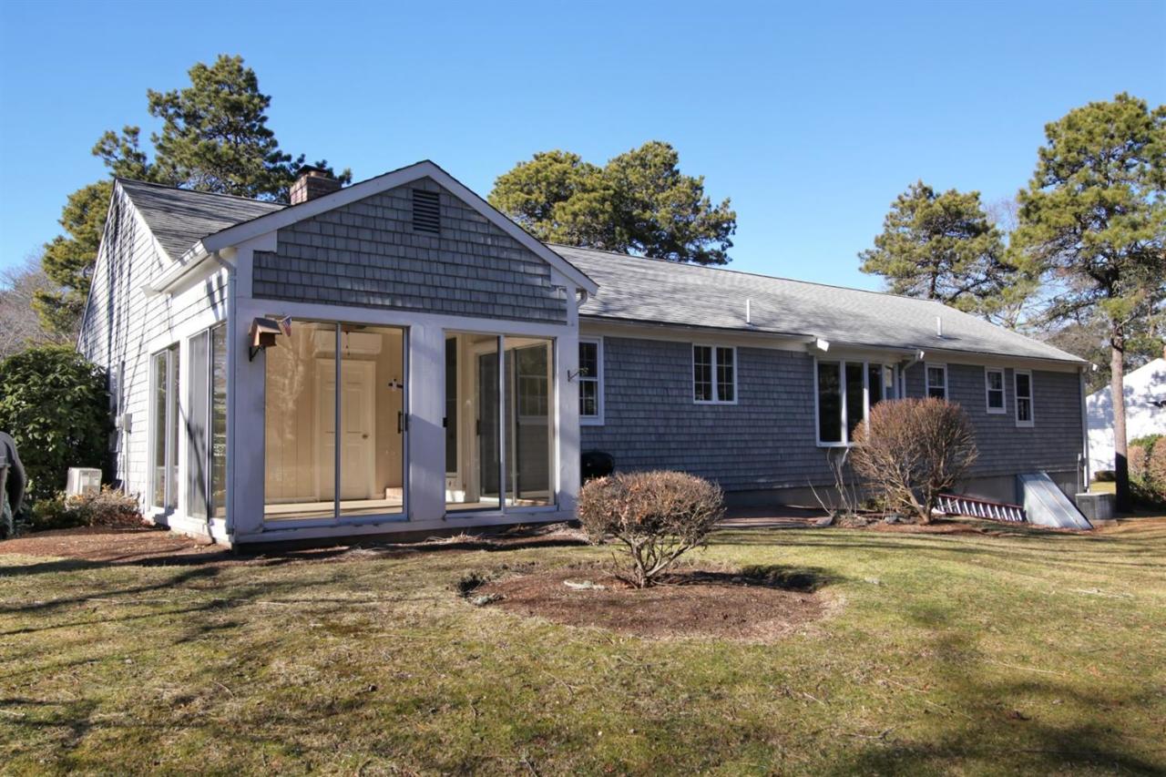 140 Ansel Howland Road Centerville, MA 02632 - Photo 24 of 26 a front view of a house with a yard