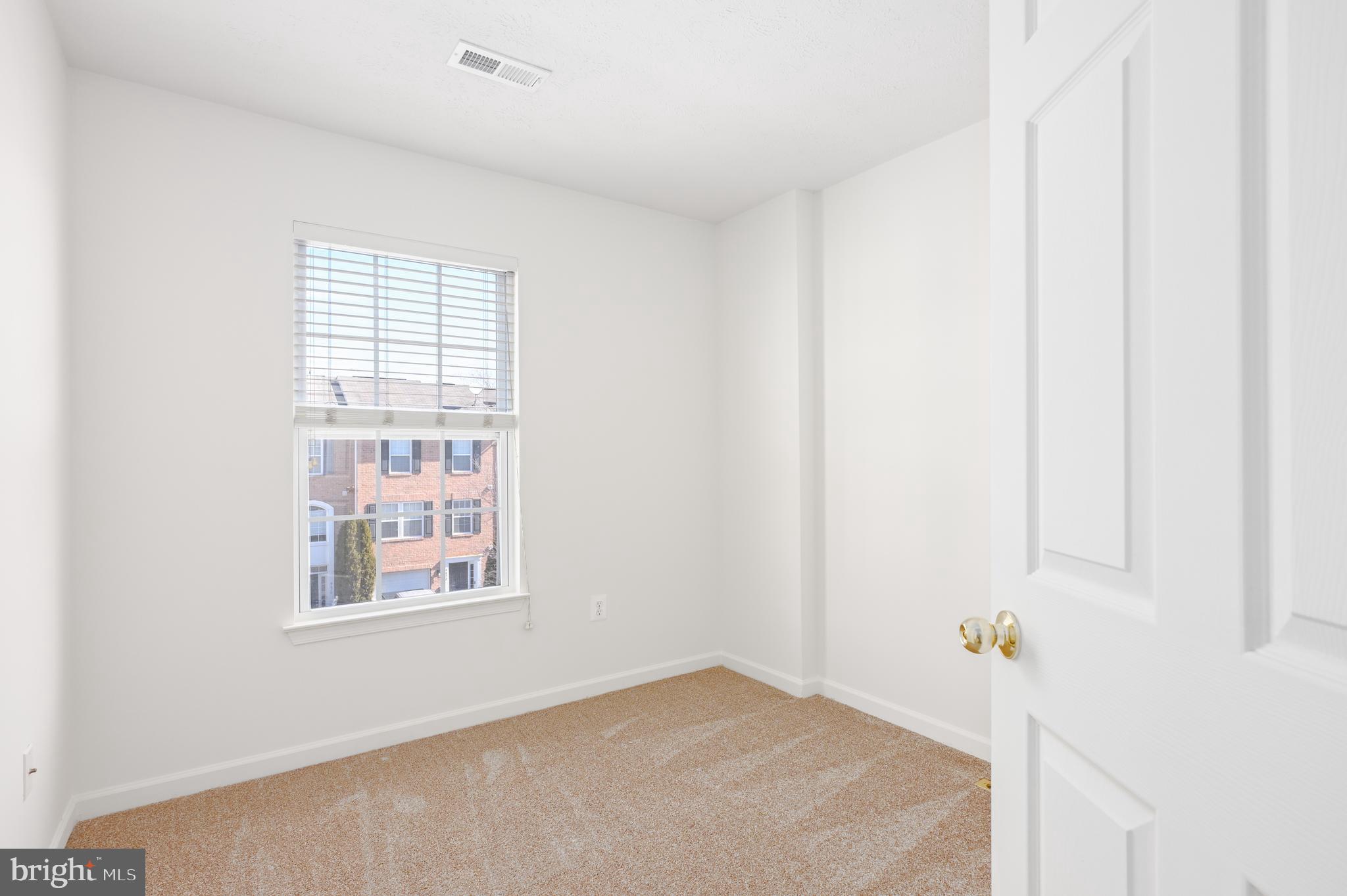 9871 Decatur Road Baltimore, MD 21220 - Photo 11 of 31 a view of an empty room with a window