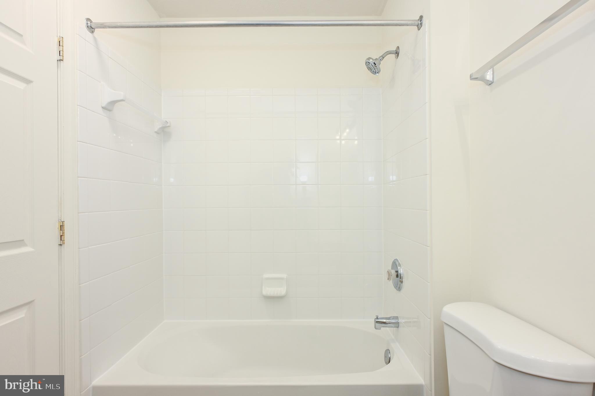9871 Decatur Road Baltimore, MD 21220 - Photo 18 of 31 a bathroom with a shower and a toilet