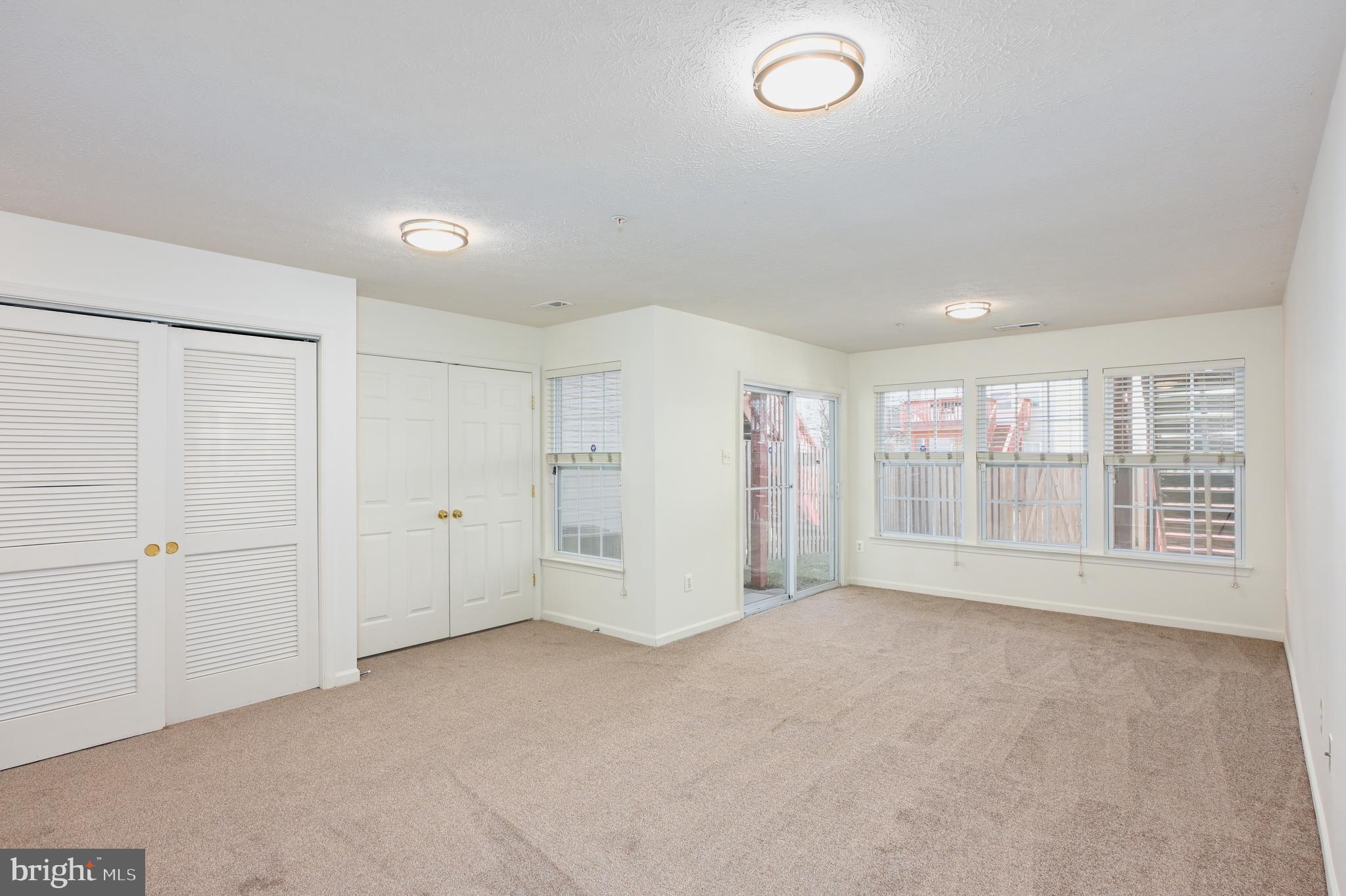 9871 Decatur Road Baltimore, MD 21220 - Photo 6 of 31 a view of an empty room with a window