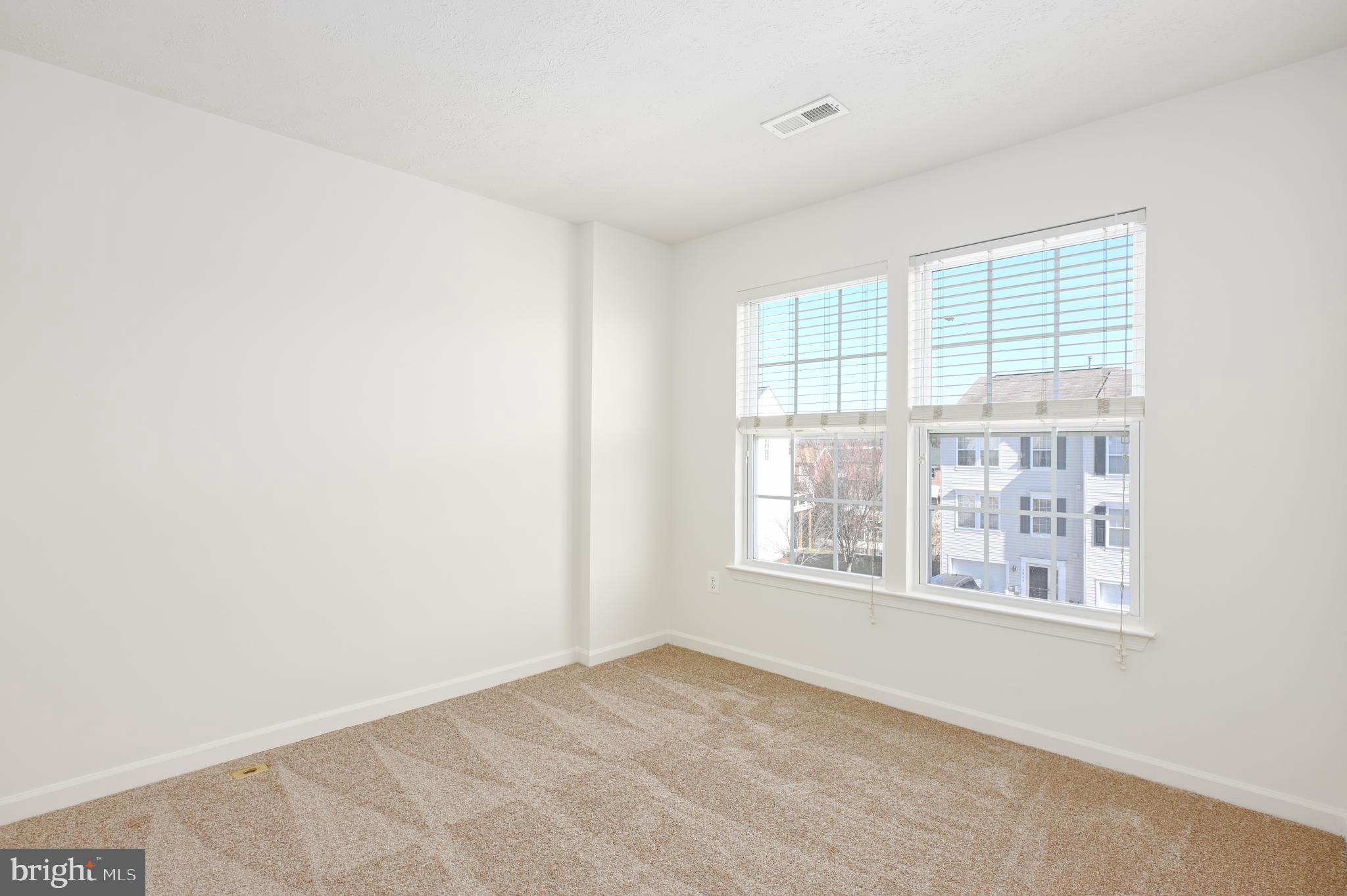 9871 Decatur Road Baltimore, MD 21220 - Photo 10 of 31 a view of an empty room with a window