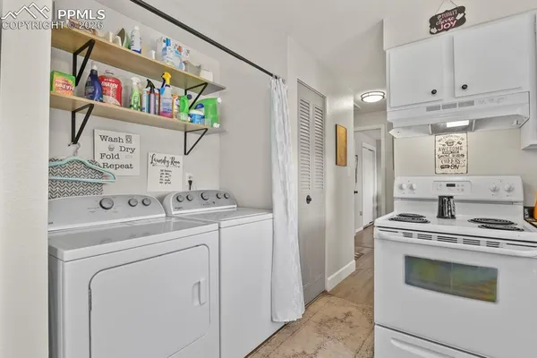 a kitchen with stainless steel appliances granite countertop a stove and a refrigerator