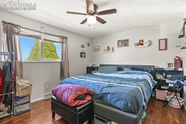 a bed room with a bed and a window