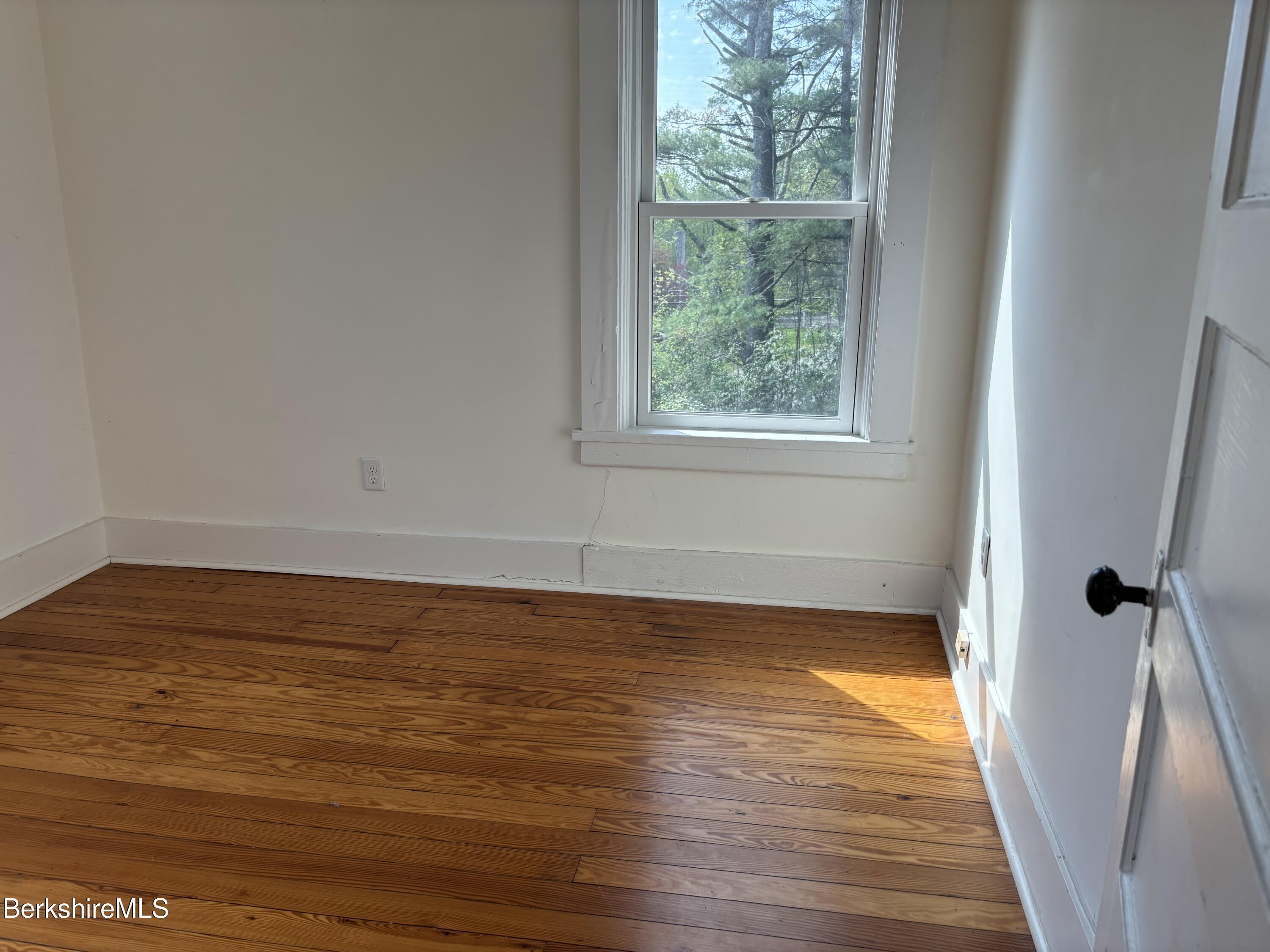 86 Miner Road Lanesborough, MA 01237 - Photo 37 of 44 a view of a room with wooden floor and window