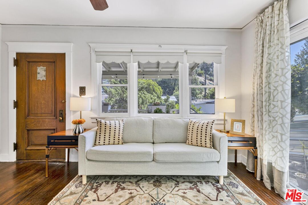 313 Museum Drive Los Angeles, CA 90065 - Photo 12 of 43 a living room with furniture and a large window