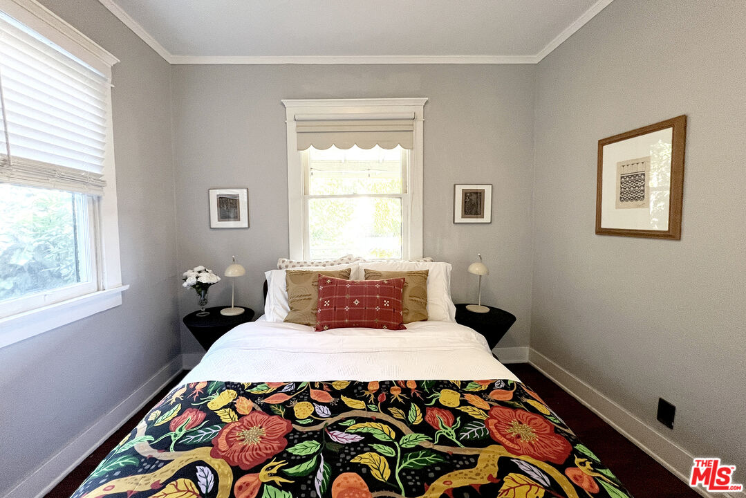 313 Museum Drive Los Angeles, CA 90065 - Photo 17 of 43 a bedroom with a bed and wooden floor