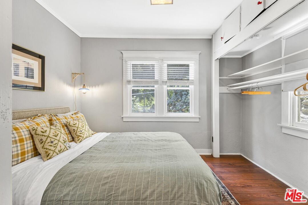 313 Museum Drive Los Angeles, CA 90065 - Photo 21 of 43 a bedroom with a bed and a window