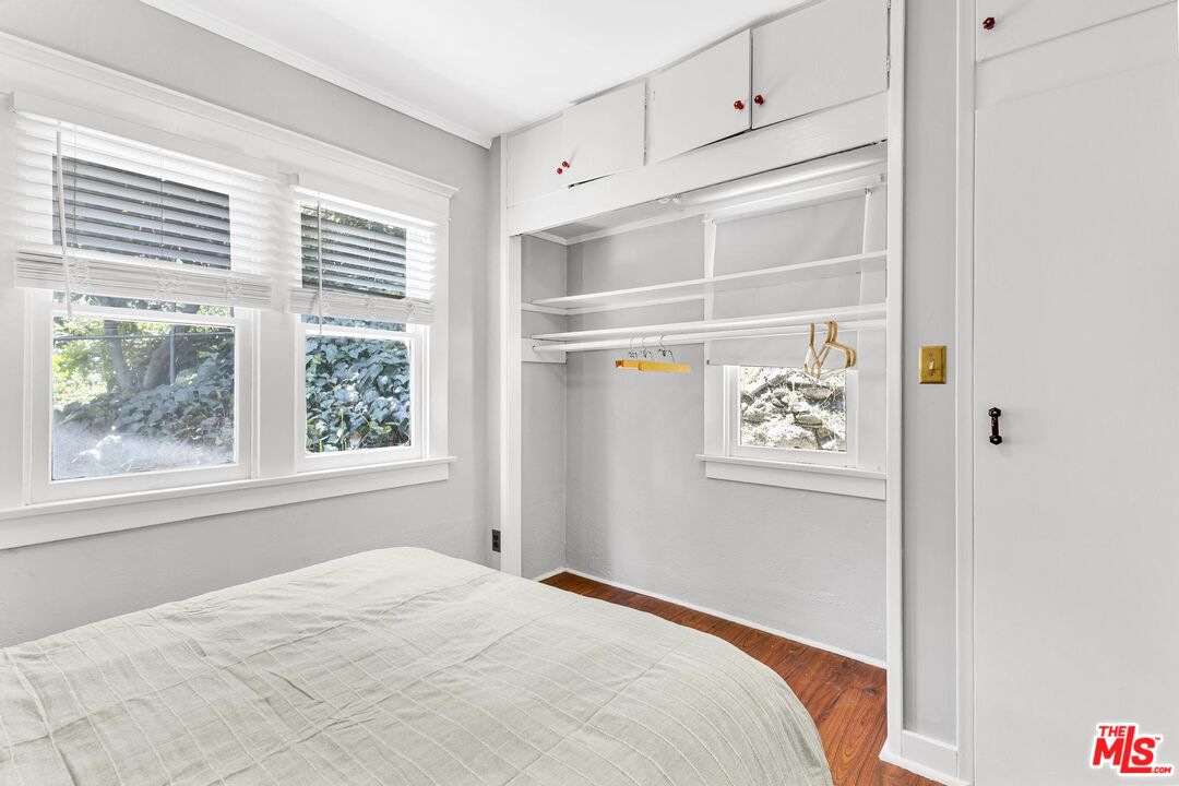 313 Museum Drive Los Angeles, CA 90065 - Photo 22 of 43 a bedroom with a bed and a window