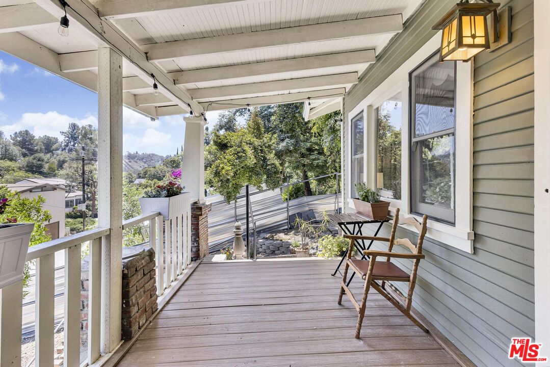 313 Museum Drive Los Angeles, CA 90065 - Photo 29 of 43 a view of a porch with furniture and wooden floor