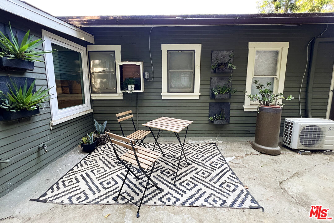 313 Museum Drive Los Angeles, CA 90065 - Photo 32 of 43 a living room with furniture and a potted plant
