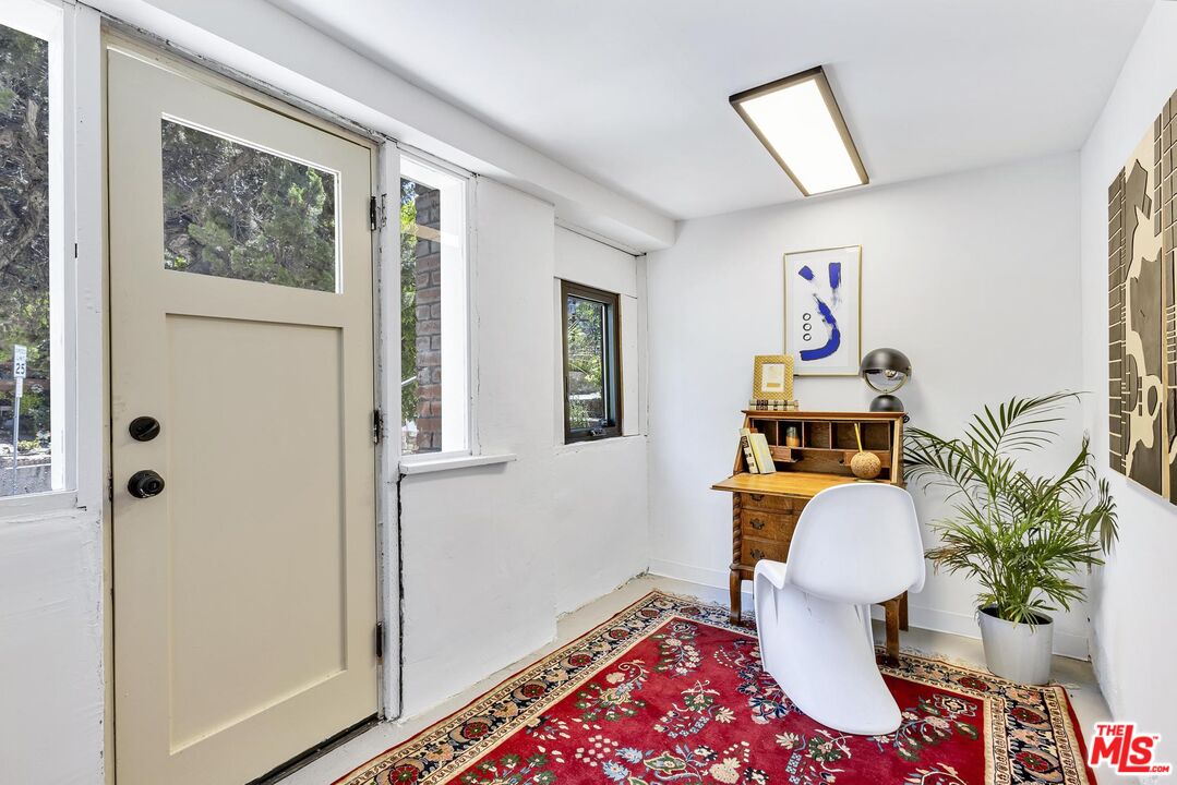 313 Museum Drive Los Angeles, CA 90065 - Photo 33 of 43 a living room with furniture and wooden floor