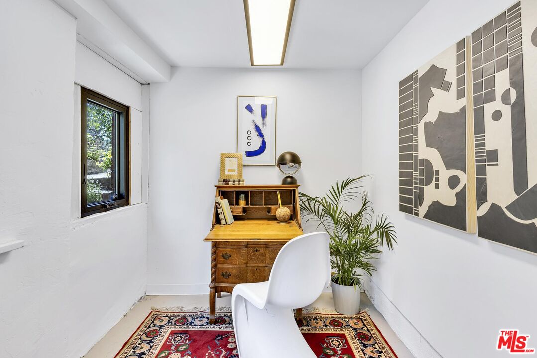 313 Museum Drive Los Angeles, CA 90065 - Photo 34 of 43 a living room with furniture and a table
