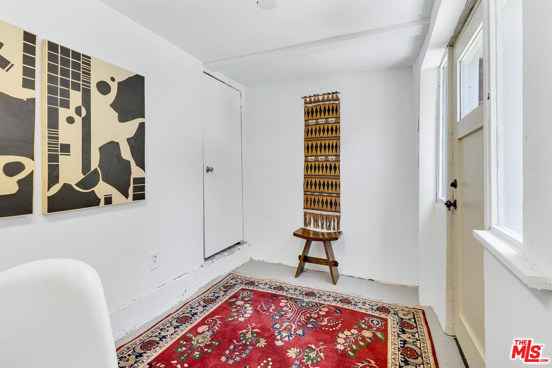 313 Museum Drive Los Angeles, CA 90065 - Photo 35 of 43 a view of an empty room with window and wooden floor
