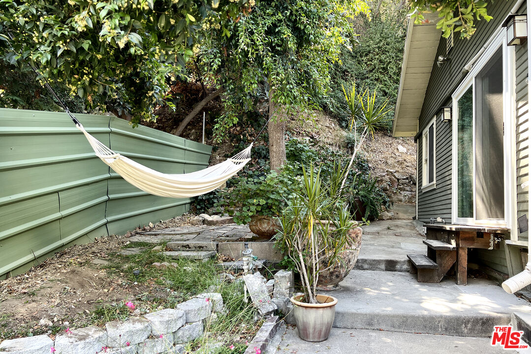 313 Museum Drive Los Angeles, CA 90065 - Photo 7 of 43 a view of a backyard with chair and potted plants