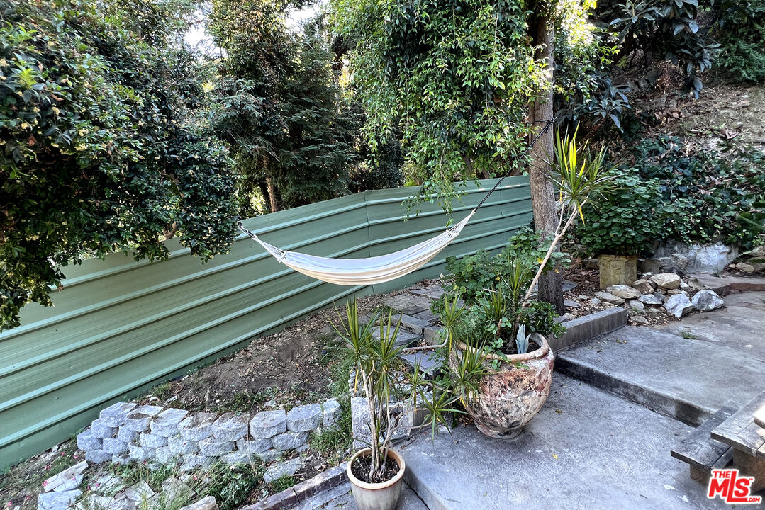 313 Museum Drive Los Angeles, CA 90065 - Photo 8 of 43 a view of a backyard with plants and a garden