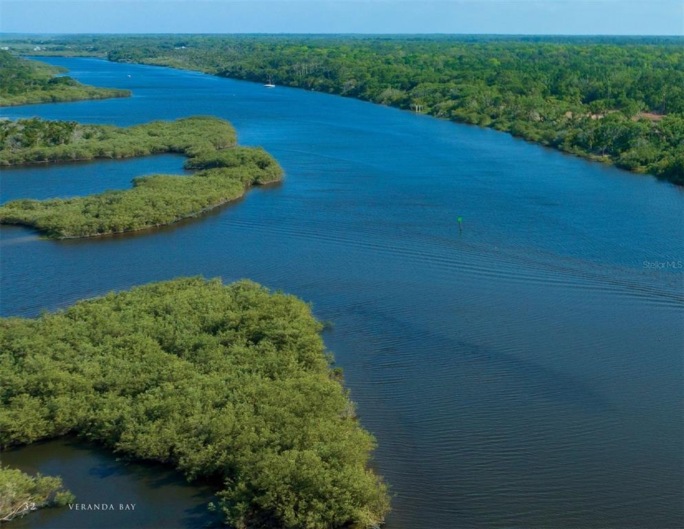 50 Coronado Road Flagler Beach, FL 32136 - Photo 3 of 16 a view of a lush green field