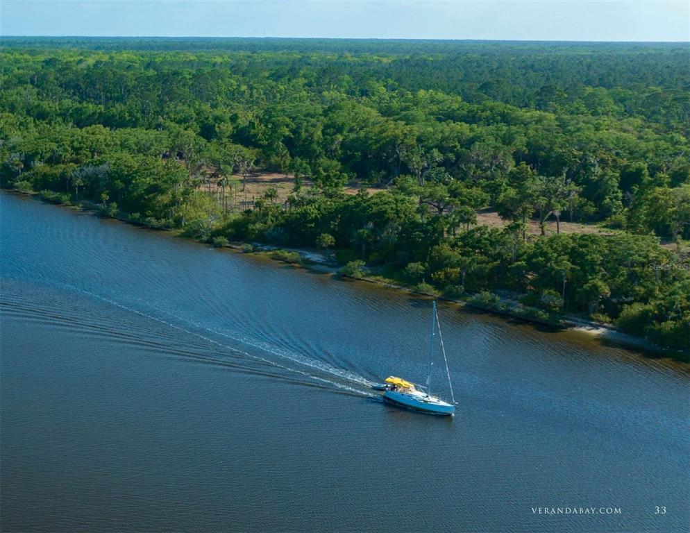 50 Coronado Road Flagler Beach, FL 32136 - Photo 4 of 16 an aerial view of a house with a yard