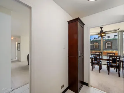 a view of a livingroom with furniture and chandelier