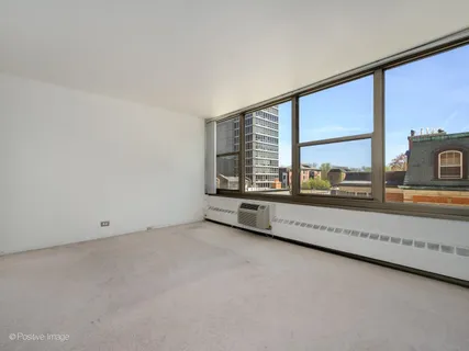 an empty room with large window