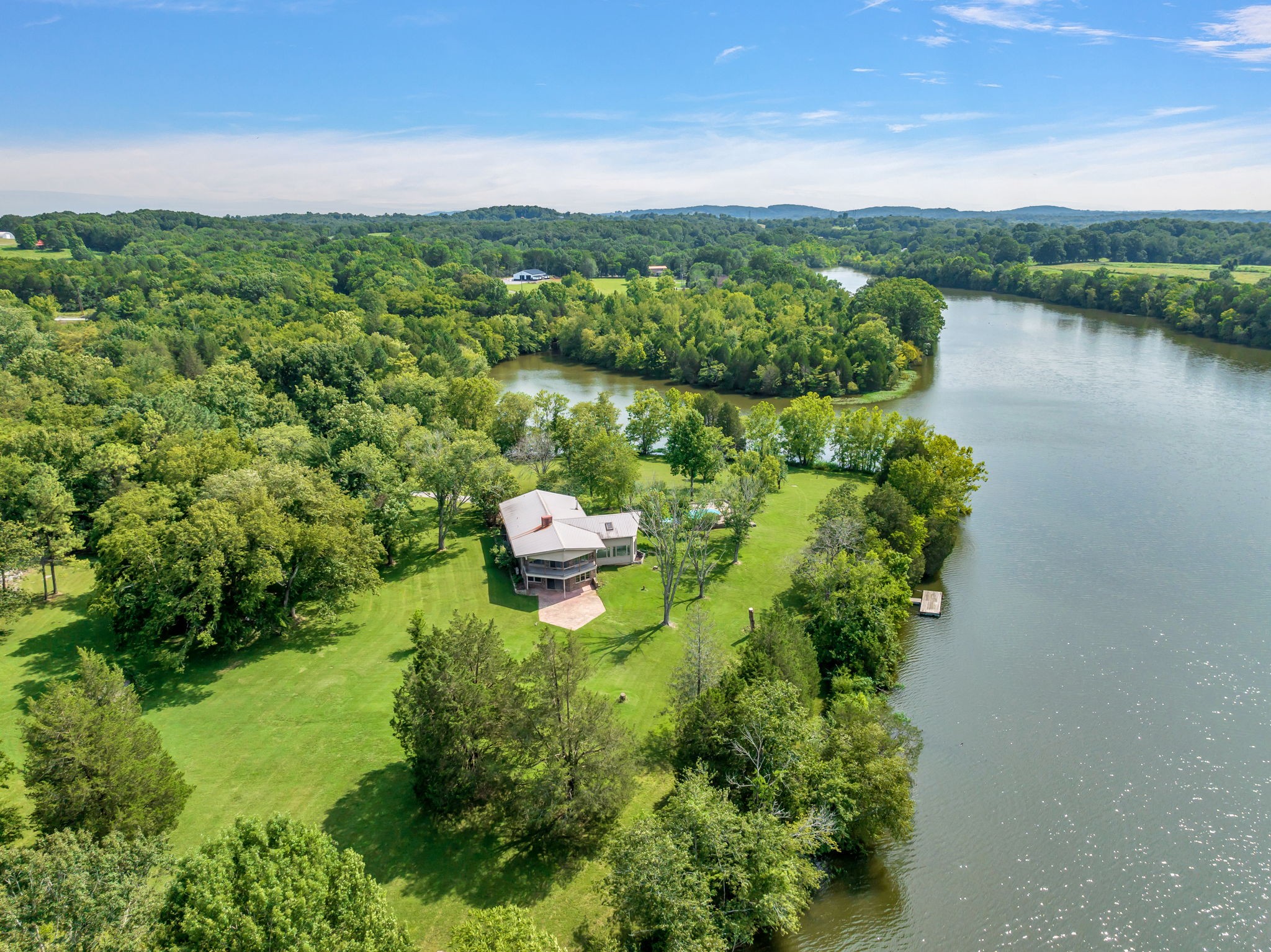 3443 Mann Road Lebanon, TN 37087 - Photo 2 of 55 a view of a lake with a mountain in the background