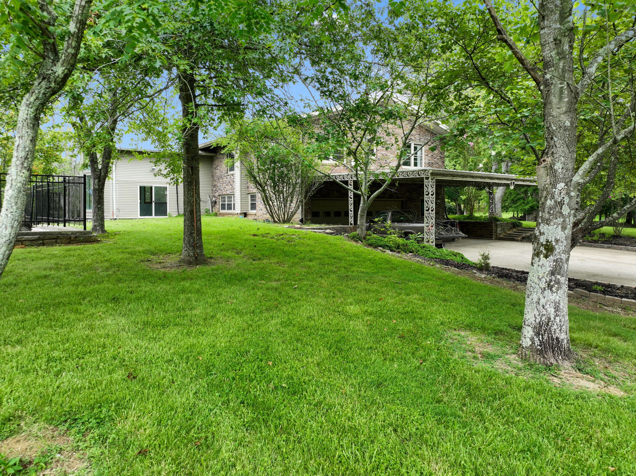 3443 Mann Road Lebanon, TN 37087 - Photo 10 of 55 a view of a house with a yard and large trees