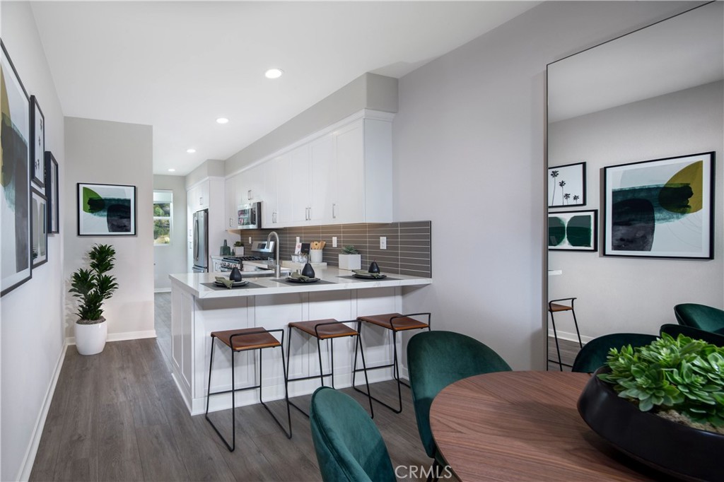 a kitchen with a table and chairs in it