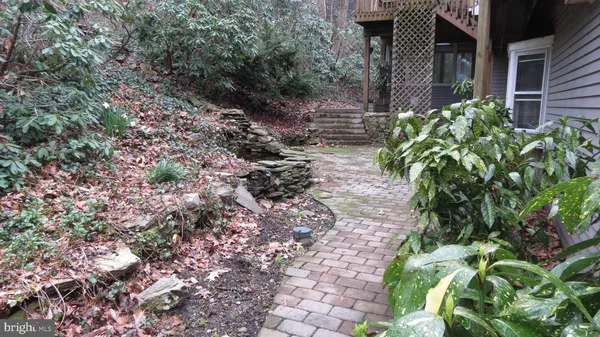 a backyard of a house with lots of green space