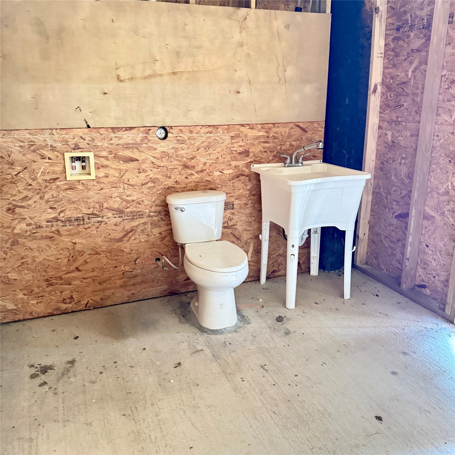 143 Bastrop Bayou Drive Angleton, TX 77515 - Photo 12 of 32 a bathroom with a toilet and a sink